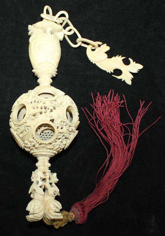 A Chinese export ivory hanging puzzle ball, 19th century, 34cm incl. chain